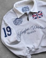 Polo Mayfair con mezza zip di Reaven Gray